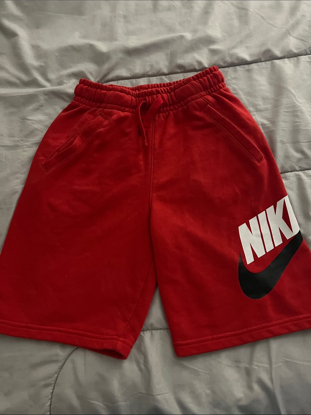 Nike Red Kids Athletic Shorts with White and Black Logo